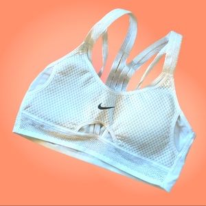 Nearly-new white Nike sports bra with straps and mesh details size medium
